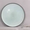 Round dinnerware in terracotta clay