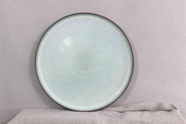 Round dinnerware in terracotta clay