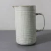 Water jug with woven lines design