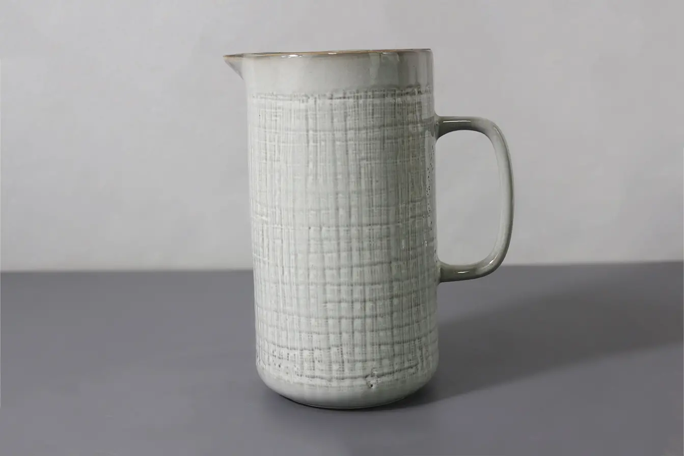 Water jug with woven lines design