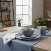 Blue Mist reactive glaze ceramic dinnerware set styled for a modern dining table