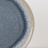 Blue Mist reactive glaze ceramic plate close-up showing soft blue gradient glaze texture
