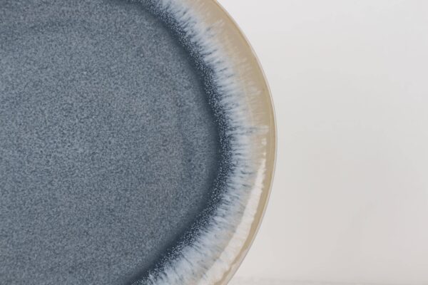 Blue Mist reactive glaze ceramic plate close-up showing soft blue gradient glaze texture