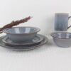 Stillstone grey reactive glaze stoneware dinnerware set with plates, bowls and mug