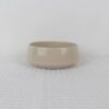 Small Sandstone beige speckled stoneware bowl with rounded sides and glossy glazed surface
